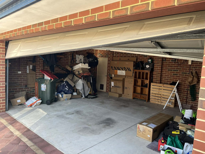 Twisted garage door before repair
